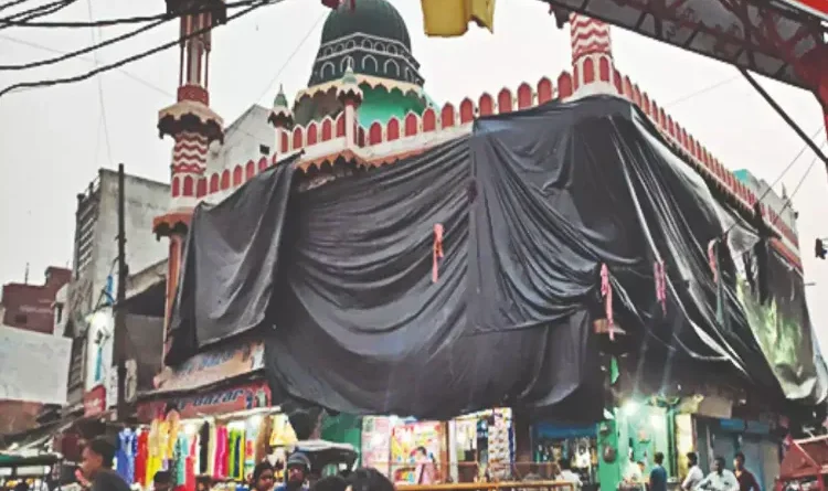 Aligarh mosque covered again before Holi