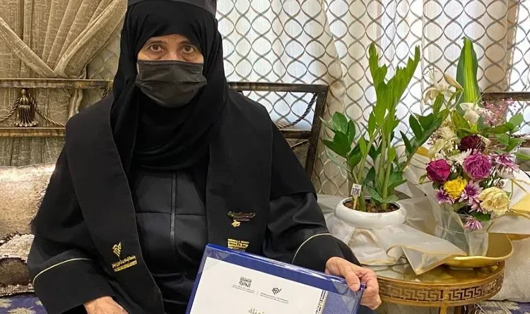 Picture of changing Arab, elderly woman Salwa Al-Omani graduates at 70